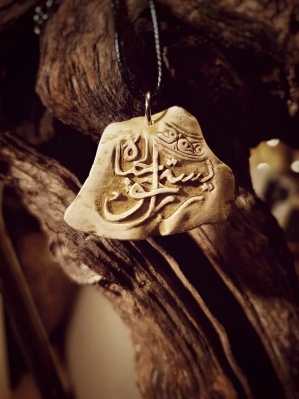 Carved Stone Pendant (Worth living for)