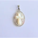 Cross pendant in oval shape